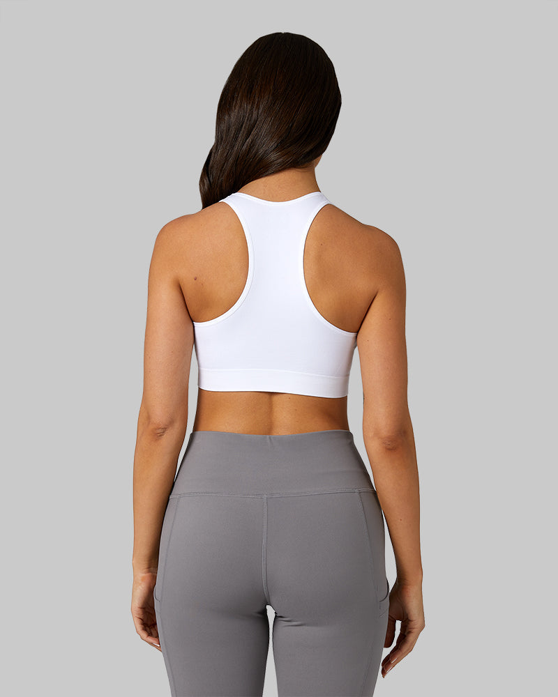 32 Degrees White _ Women's Seamless Racberback Sports Bra {model: Bruna is 5'7" and size 4, wearing size S}{bottom}{right} 