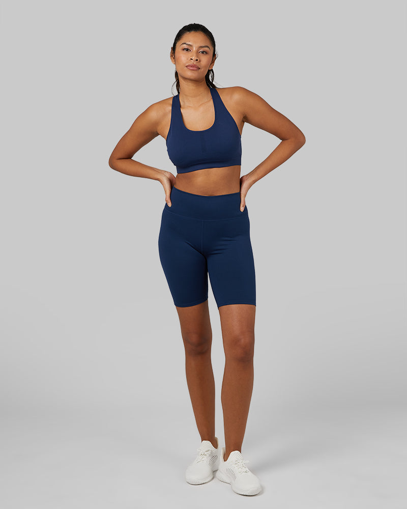 32 Degrees Inky Indigo _ Women's Seamless Racerback Sports Bra {model: Victoria is 5'10" and size 4-6, wearing size S}{bottom}{right} {bottom}{right}
