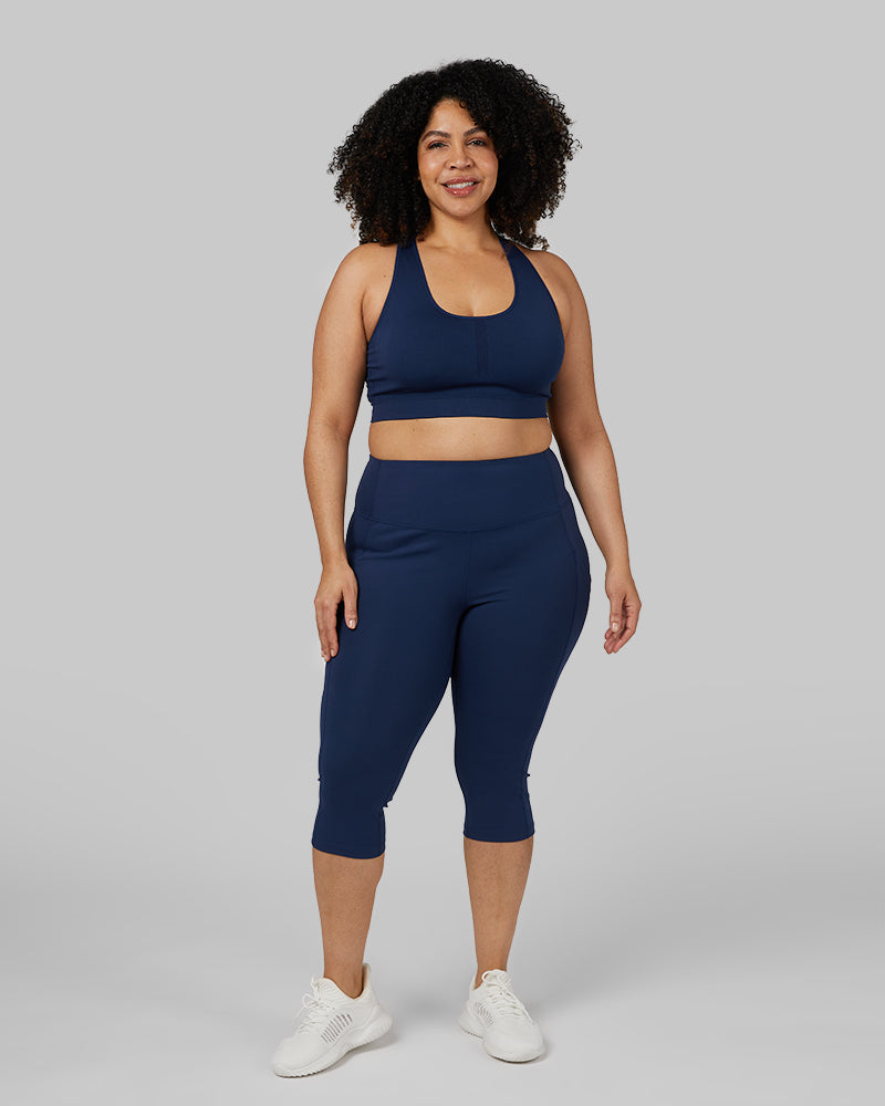 32 Degrees Inky Indigo _ Women's Seamless Racerback Sports Bra {model: Genny is 5'8" and size 12-14, wearing size L}{bottom}{right} {bottom}{right}

