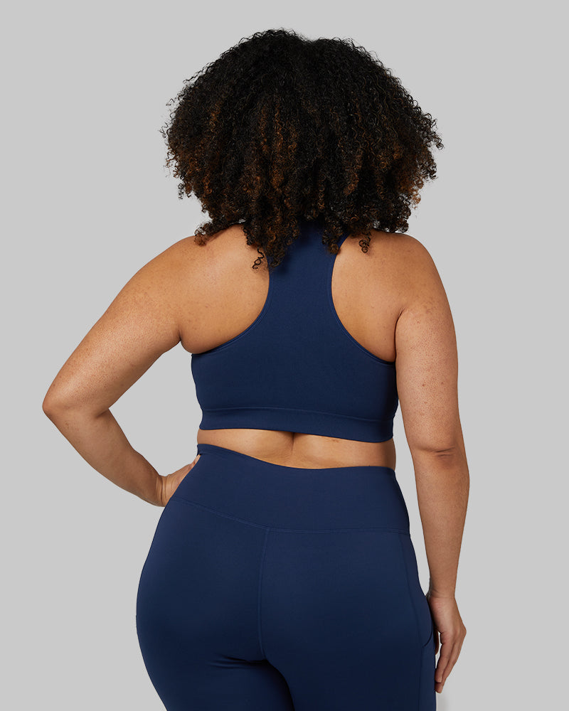 32 Degrees Inky Indigo _ Women's Seamless Racerback Sports Bra {model: Genny is 5'8" and size 12-14, wearing size L}{bottom}{right} {bottom}{right}
