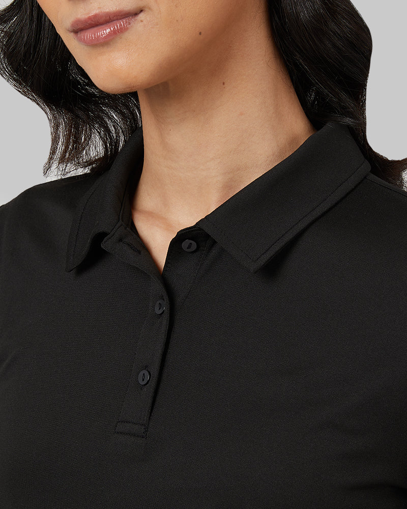 32 Degrees Black _ Womens Cool Fitted Polo {model: Rowena is 5'8" and size 4, wearing size S}{bottom}{right} {bottom}{right}