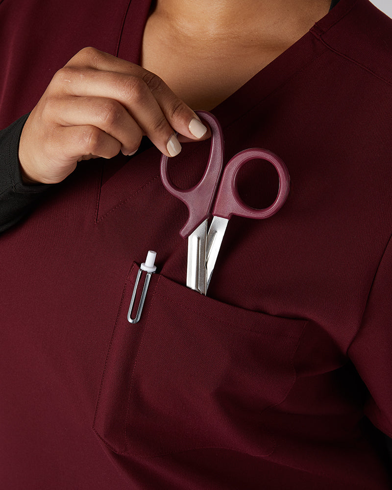 32 Degrees Burgundy _ Womens 1-Pocket V-Neck scrub Top {model: Madison is 5'9and size 16 wearing size XL}{bottom}{right} {bottom}{right}