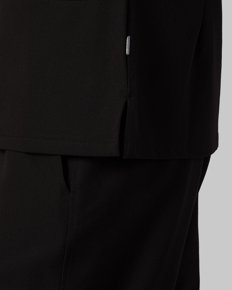 32 Degrees Black _ Women's 2-Pocket V-Neck scrub Top {model: Colby is 5'9"and size 4 wearing size S}{bottom}{right} {bottom}{right}
