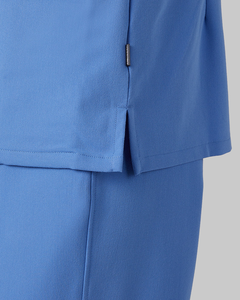 32 Degrees Blue Sky _ Women's 2-Pocket V-Neck scrub Top {model: Colby is 5'9"and size 4 wearing size S}{bottom}{right} {bottom}{right}