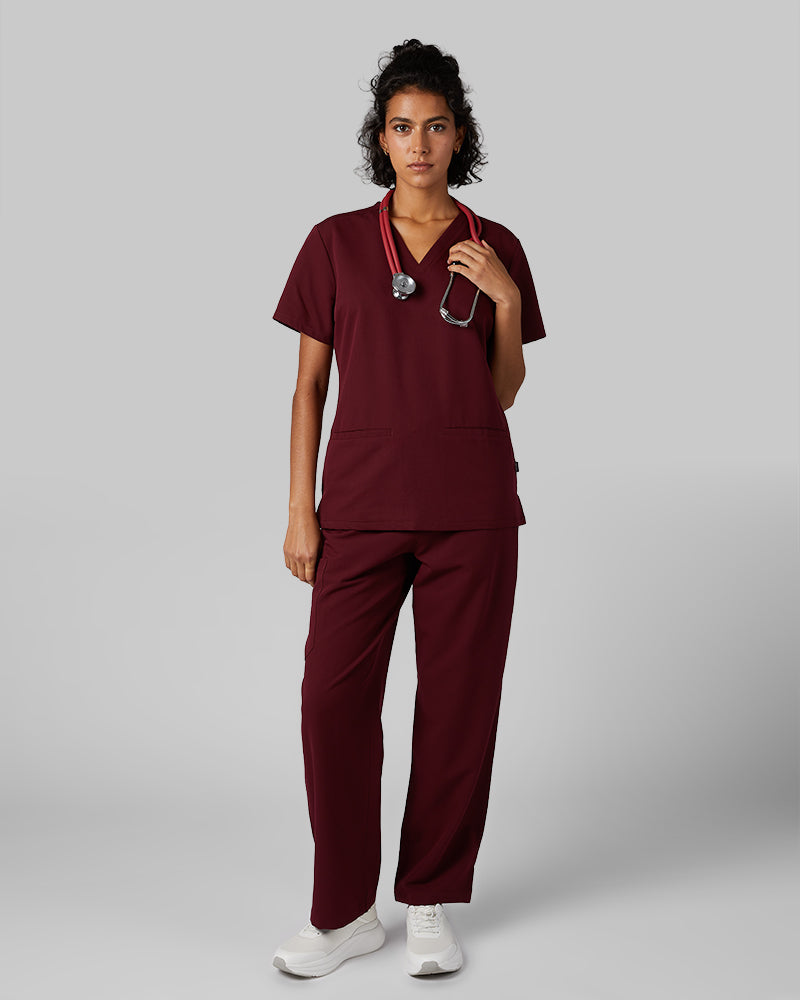 32 Degrees Burgundy _ Women's 2-Pocket V-Neck scrub Top {model: Arantza is 5'9"and size 2 wearing size XS}{bottom}{right} {bottom}{right}