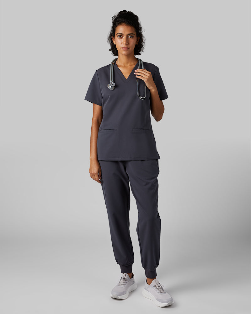 32 Degrees Charcoal _ Women's 2-Pocket V-Neck scrub Top {model: Arantza is 5'9"and size 2 wearing size XS}{bottom}{right} {bottom}{right}