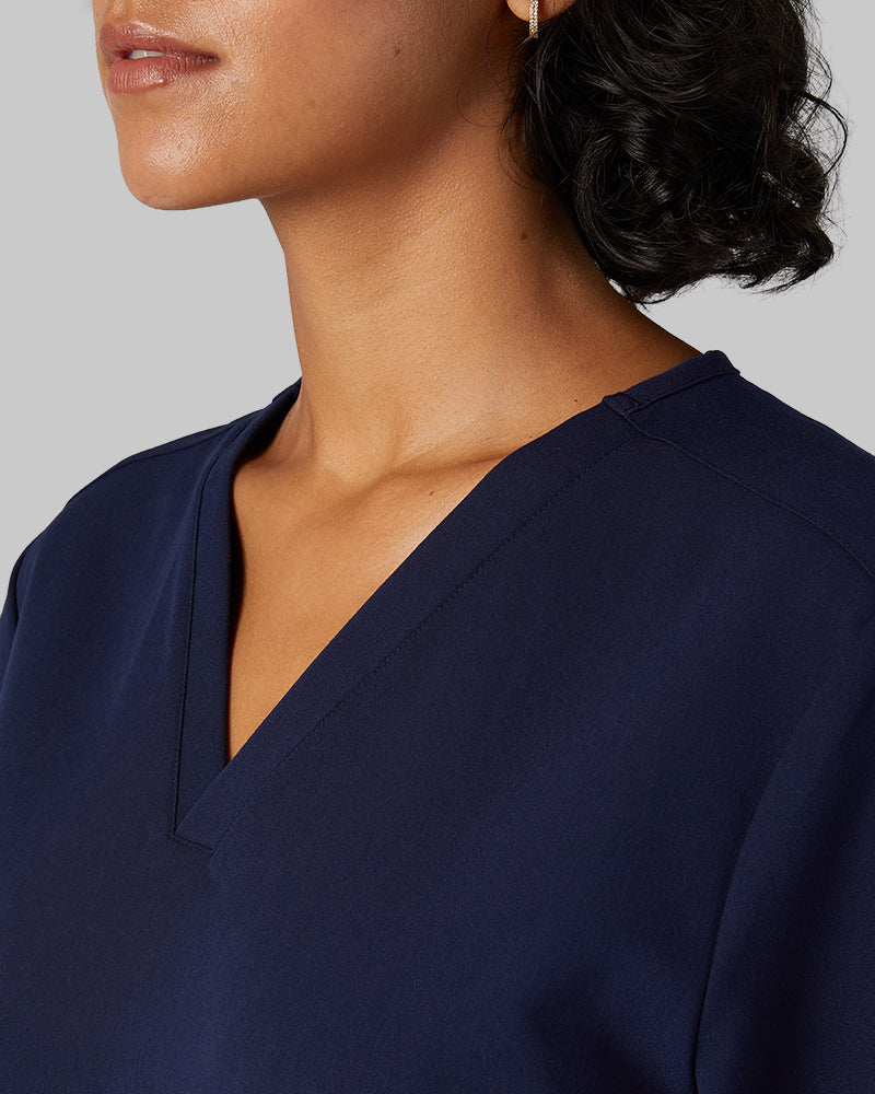 32 Degrees Navy _ Women's 2-Pocket V-Neck scrub Top {model: Arantza is 5'9"and size 2 wearing size XS}{bottom}{right} {bottom}{right}