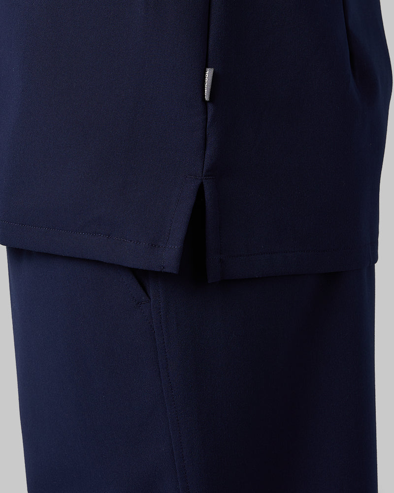 32 Degrees Navy _ Women's 2-Pocket V-Neck scrub Top {model: Arantza is 5'9"and size 2 wearing size XS}{bottom}{right} {bottom}{right}