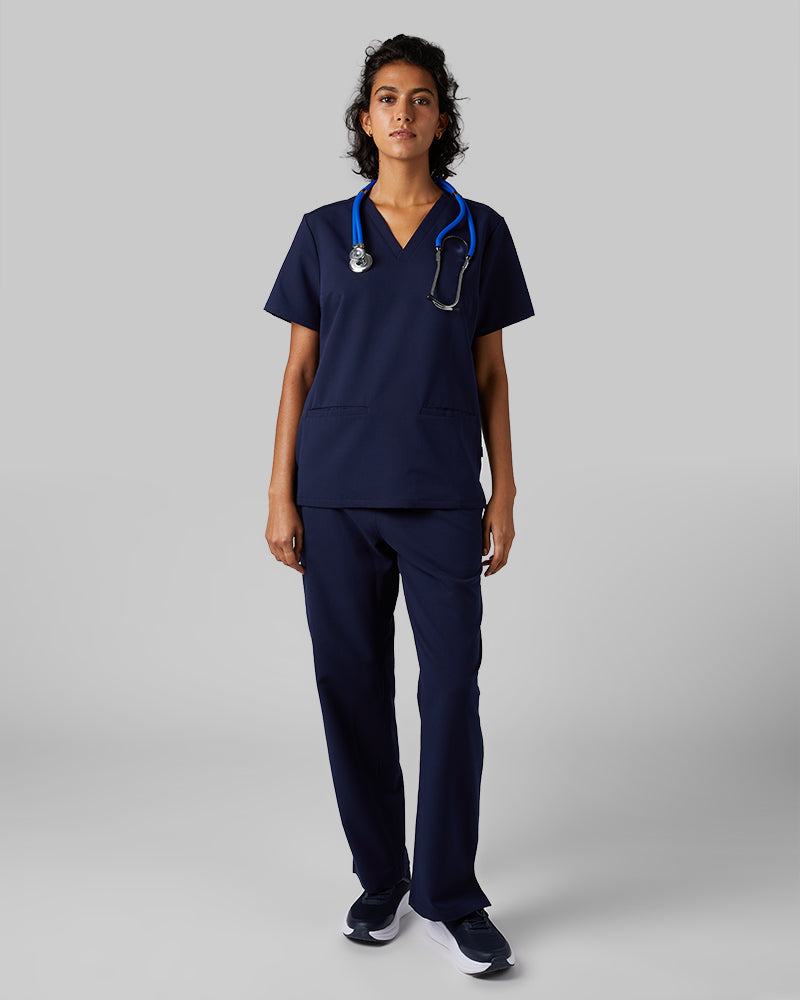 32 Degrees Navy _ Women's 2-Pocket V-Neck scrub Top {model: Arantza is 5'9"and size 2 wearing size XS}{bottom}{right} {bottom}{right}