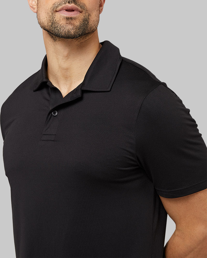 32 Degrees Black _ Men's Cool Classic Polo {model: Daniel is 6'2", wearing size M}{bottom}{right}